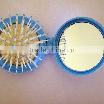 small cute circle mirror with comb