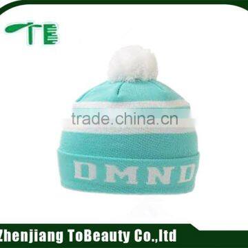 light green beanie hat with white ball