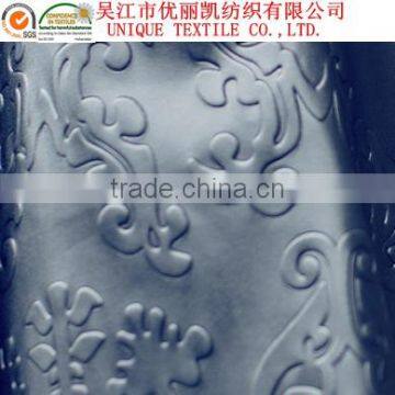 Embossed polyester fabric