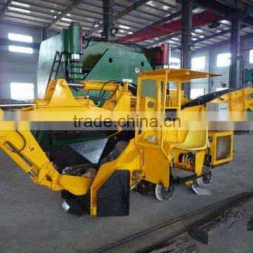 Excavating crawler mining loader tunnel mucking machine with scraper