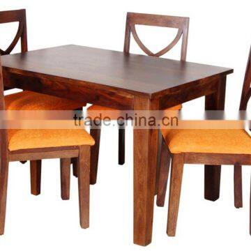 Natural brown four sitter wooden dining set with cushion chair