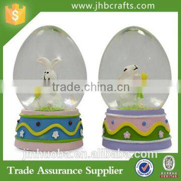 Set of Egg Shaped Easter Bunny Rabbits Snow Globe