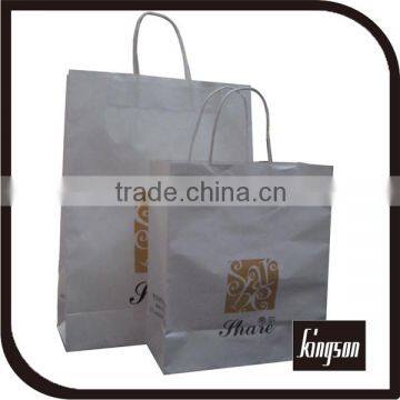 white craft paper bag in paper bag