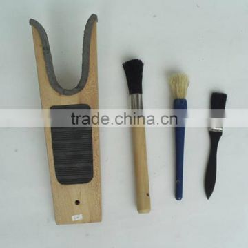 wooden boot jack and hoof painting brush