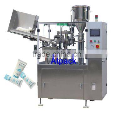Automatic tube filling and sealing machine