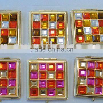 metal pocket mirror in square shape with diamond on the surface