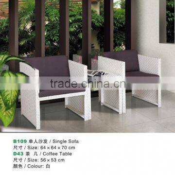 white rattan coffee table and sofa