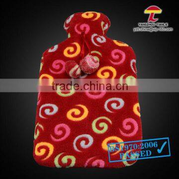 BS standard natural rubber hot water bottle with colourful circles coral fleece cover