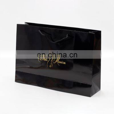 Shiny black handbag with hot stamping logo embossing on surface cardboard paper bag for gift products packing wine bag