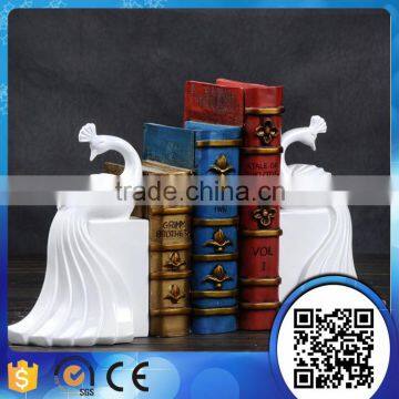 Wholesale polyresin craft white peacock bookends animal bookend for study room decoration                        
                                                                                Supplier's Choice