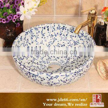 Elaborate ceramic material Hair Wash Basin with hand-painted blue and white