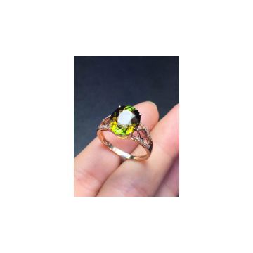 Classical natural green tourmalines 18k gold ring set with diamonds.