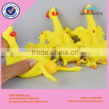 Hot selling cheap creative trick-playing toy yellow rubber chicken lays eggs toy, plastic keychain toy