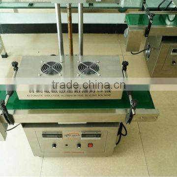 2014 newest automatic electric inductor aluminum foil seam sealing machine