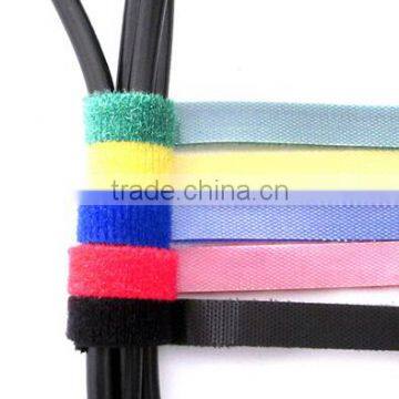 Self adhesive adjustable double side hook and loop fastener