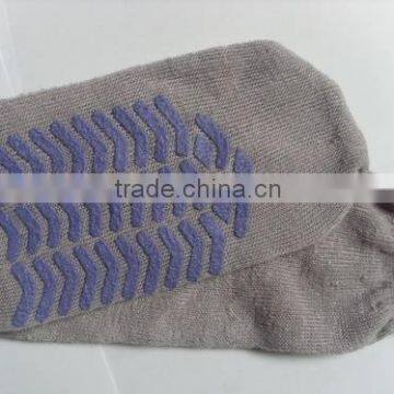 Grey airline inflight sock with plastic dot