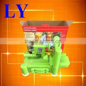 green plastic three blade vegetable spiral slicer