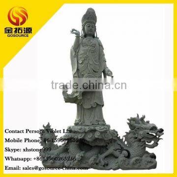 kuan yin statue on the dragon