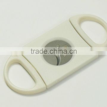 white plastic cigar cutter