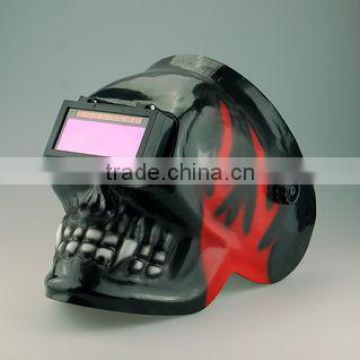 Auto darkening solar powered welding helmet skull