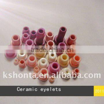 Textile ceramic eyelet