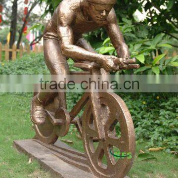 Bronze sportsman riding bike statue