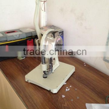 Semi automatic eyelet punching machine