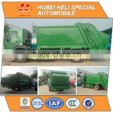 SINOTRUK HOWO 4x2 12cbm refuse compactor WD615.92 266hp with pressing mechanism