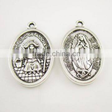 Catholic oval nuestra senora de guadalupe santo nino de atocha pendant