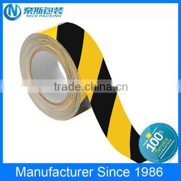 yellowish black pvc warn tape use for underground, traffic