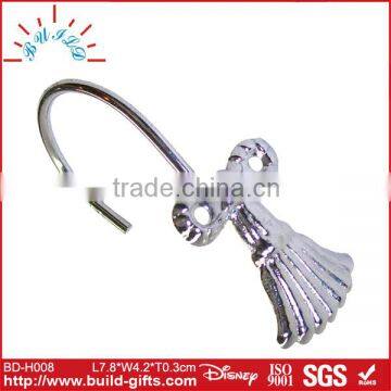 silver curved shower rod