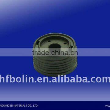 Sinter piston with PTFE banding for shock absorbers