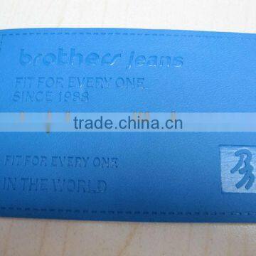 Jeans brand leather labels with metal decoration