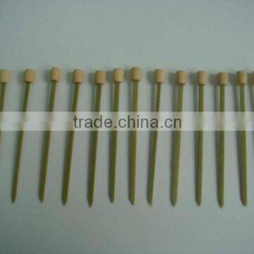 green bamboo skewers with bead at the top