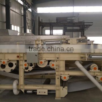 Continous operation belt type filter press for paper pulp