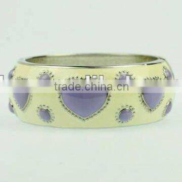 Fashionable girl's big metal bangle