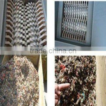 Dual axis shredder for biomass fermentation of solid waste