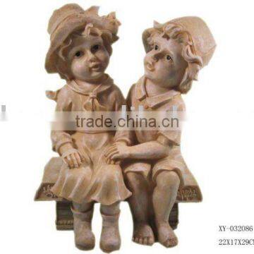 Polyresin boy and girl figurine