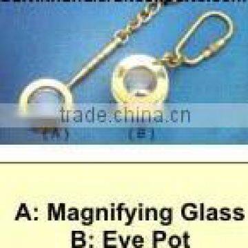 magnifying glass and eyepot key chains