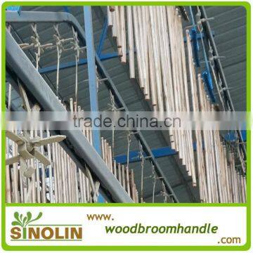 varnished wood broom handle machine