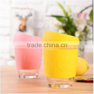 340ml Heat resistant borosilicate Glass water cup with silicone sleeve and silicone cap.