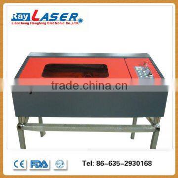 low cost acrylic trade assurance co2 laser engraving cutting machine for wood leather