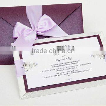 pink bow elegant and romantic wedding invitation card.