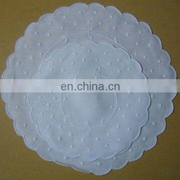 pure white linen napkins with embroidery in round shape