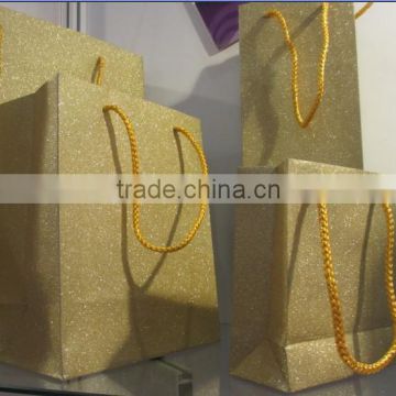 Different size of glitter gift bag with gold string