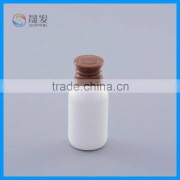 Round small cosmetic plastic bottle