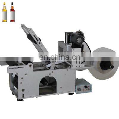 Glass bottle plastic bottle semi-automatic self-adhesive labeling machine