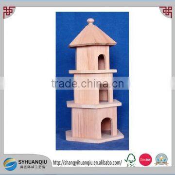 Wooden bird cage with three cells, tower shaped