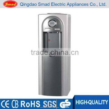 Compressor cooling water dispenser with stainless steel tank to improve water taste