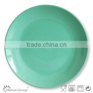 green colorful stoneware round salad plate